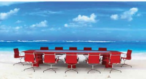 Conference style table and chairs on the Sandals beach water side.