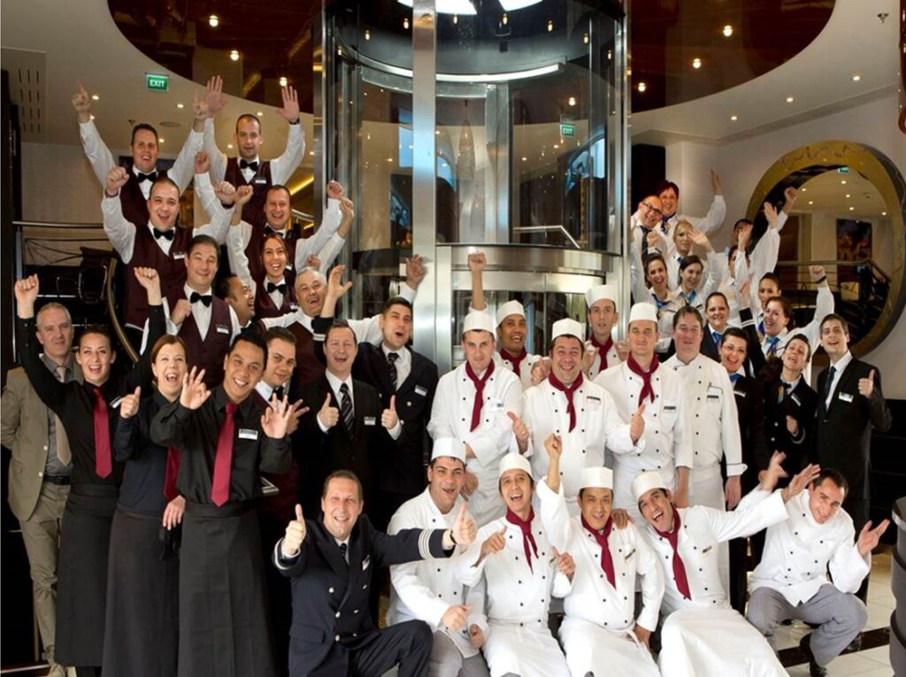 Golf Ahoy Danube River Golf Cruise AmaMagna chefs and waiters group welcome aboard thumbs up 