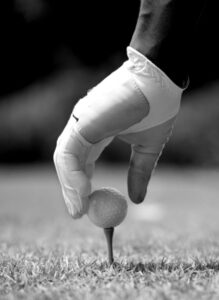 South Africa Golf Cruise Golfer placing golf ball on tee showing gloved hand