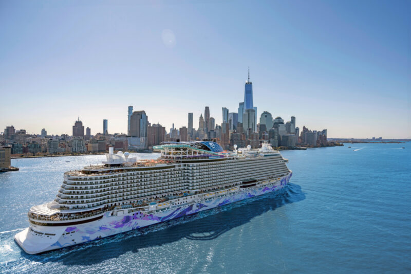 NCL Luna cruise ship sailing from New York in the background.
